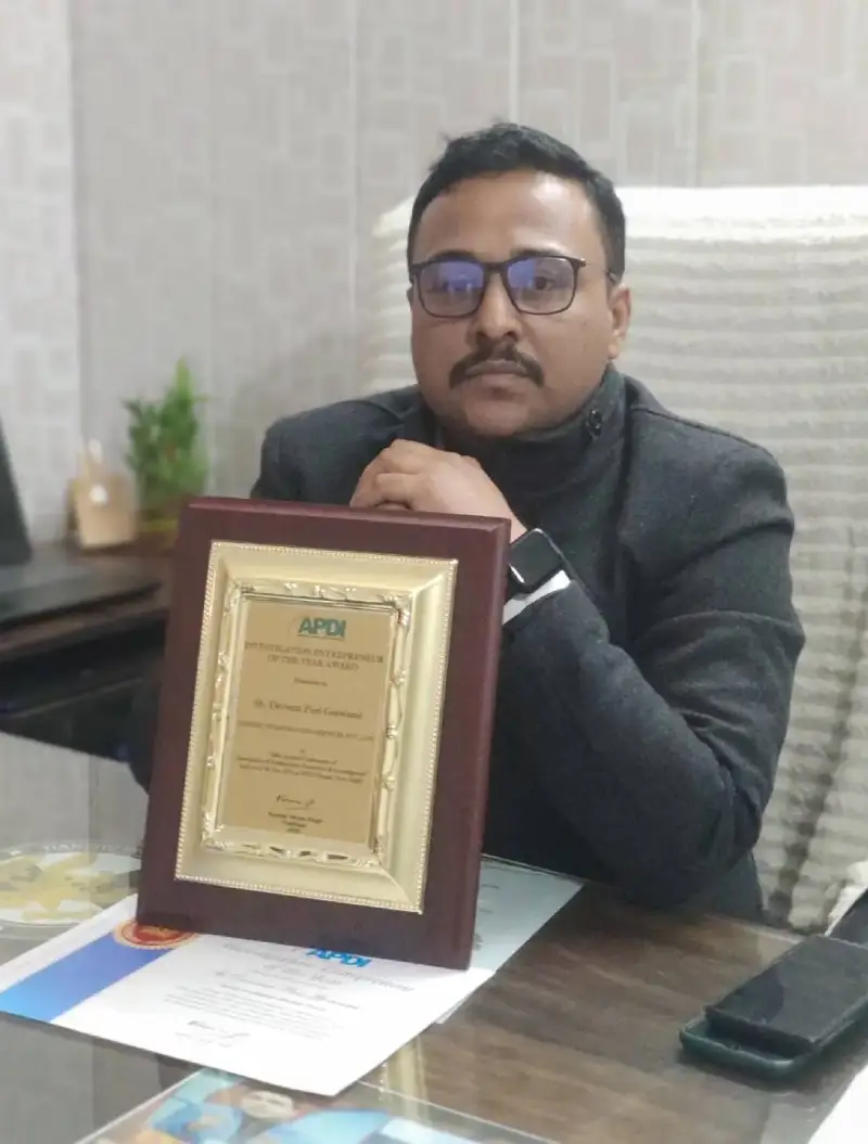 Detective with his Award at office.